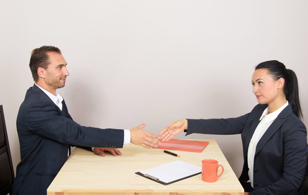 118884572 - Businessman and businesswoman shaking hands in office
© rodjulian